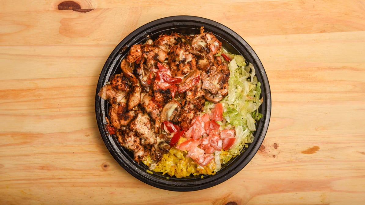 Grilled chicken bowl over yellow rice